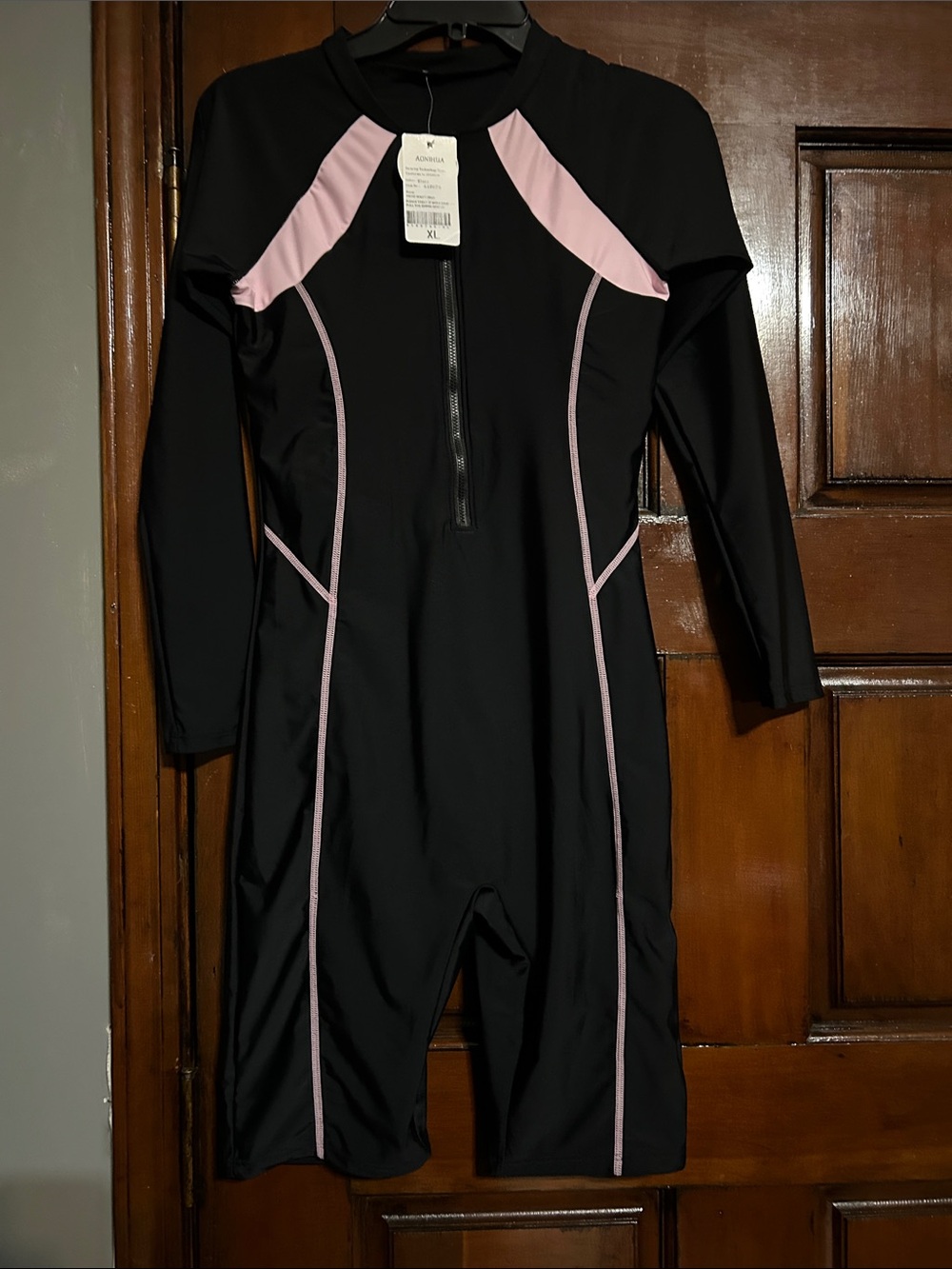 Woman’s Long Sleeve Black Swim Suit with Pink Accents - Brand: